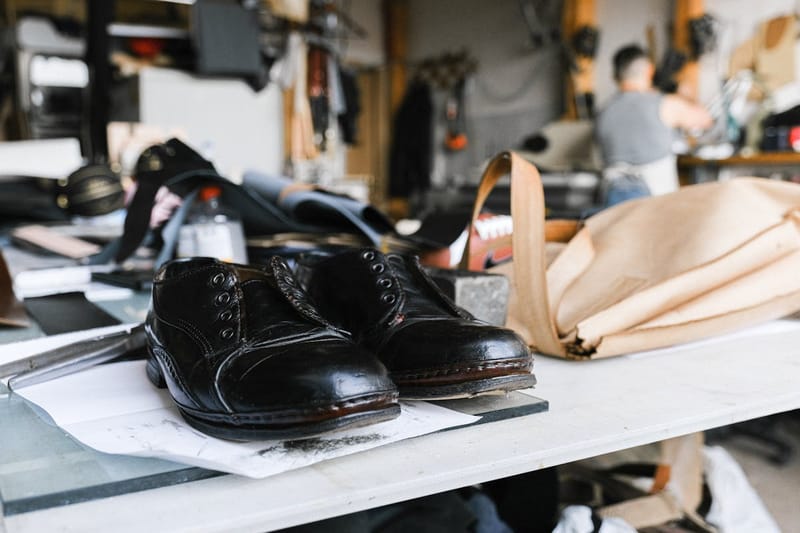 Leather shoes on a cobbler's workbench